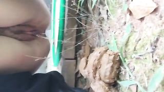 Peeing on a big pile of shit