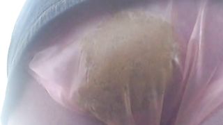 Shitting in pink plastic panties