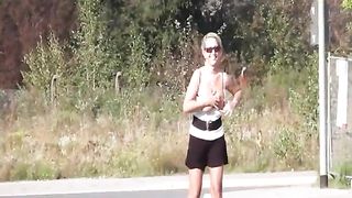 Busty blonde peeing in public