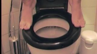 Amateur babe pooping over the toilet