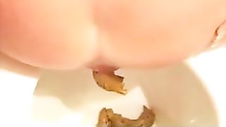 Two sexy girls shitting by turn