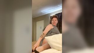 Man makes a woman squat and shit on a statue