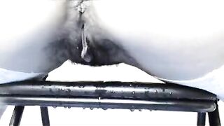 Woman pisses on a metal object