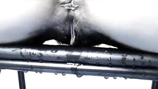 Woman pisses on a metal object