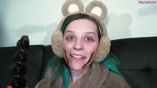 Girl in bunny ears eats shit off her face