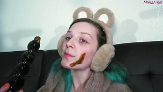 Girl in bunny ears eats shit off her face