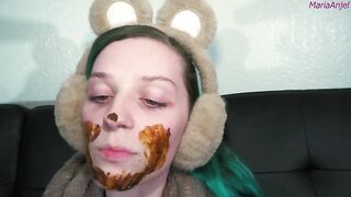Girl in bunny ears eats shit off her face