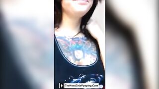 Woman pisses in a toilet and pulls a massive turd.