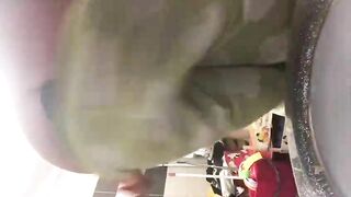 Woman takes a shit on a toilet