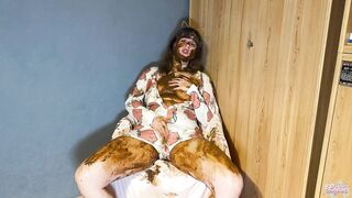 Woman takes a huge shit on the bed while wearing a animal onesie