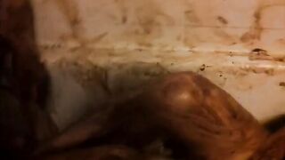 Girl covered in shit smears it on her face and body
