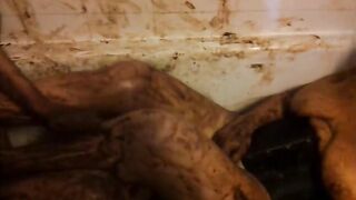Girl covered in shit smears it on her face and body
