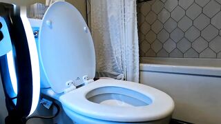 Girl squats on the toilet to take a shit