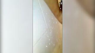 Girl spreads shit all over her pussy in the bathtub