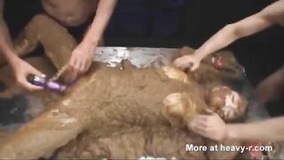 Babe covered in shit while two girls dildo her in ass