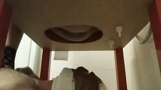 Woman spreads her asshole with her fingers in the shower