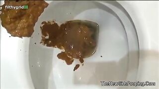 Girl takes a shit in a toilet and inspects it