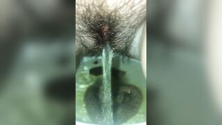 Babe sits on the toilet and takes a big shit in water