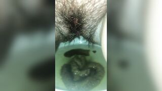 Babe sits on the toilet and takes a big shit in water