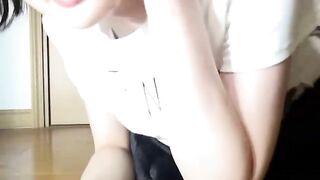 Girl pisses on a white towel