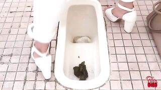 Chick takes a big shit on the toilet and washes her ass