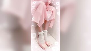 Girl in pink diaper takes a shit in white potty chair