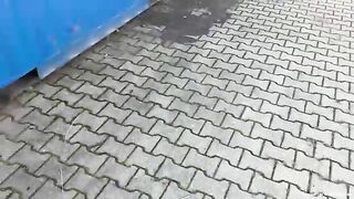 Naked blonde shit from the roof of a container