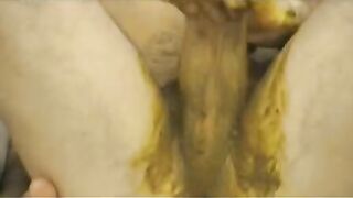 Woman spreads her ass while playing with her shit