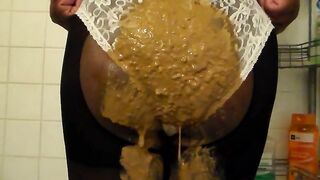 Black bitch poops on white panty