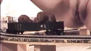 Woman Shits On A Toy Model Train
