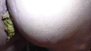 Woman shits in ass while fucking herself with a dildo