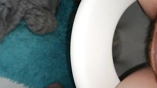 Girl takes a shit on a blue shaggy rug