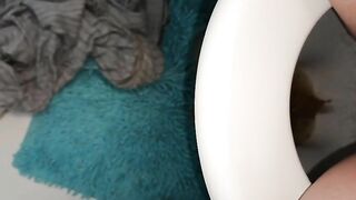 Girl takes a shit on a blue shaggy rug