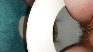 Girl spreads her ass wide on a toilet