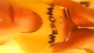 Girl fucks her ass with a dildo wearing a cartoon shirt