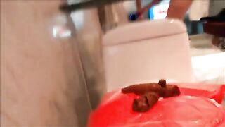Girl takes a huge shit on the toilet seat in bathroom