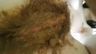 Woman smears shit over her breasts and stomach