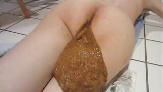 Woman spreads her ass cheeks apart to show her shit