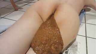 Woman spreads her ass cheeks apart to show her shit