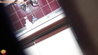 Woman in pajamas takes a shit on the toilet
