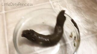 Girl takes a huge shit into a bowl