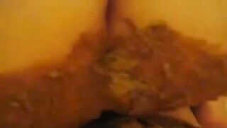 A woman masturbates while sitting in her own shit