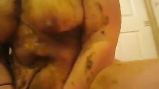 A woman masturbates while sitting in her own shit