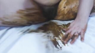 Woman rubs shit all over her legs and the bed