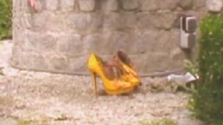 Girl drops a huge shit in the grass while wearing high heels