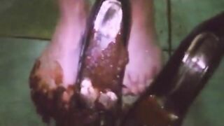 Woman steps in a pile of shit with heels on
