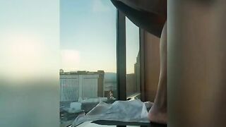 Woman takes a piss off her balcony