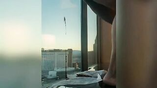 Woman takes a piss off her balcony