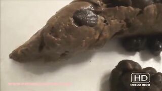 Bare assed woman takes a huge shit on the bathroom floor