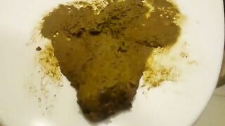 Woman takes a shit in the toilet and smears it on her face